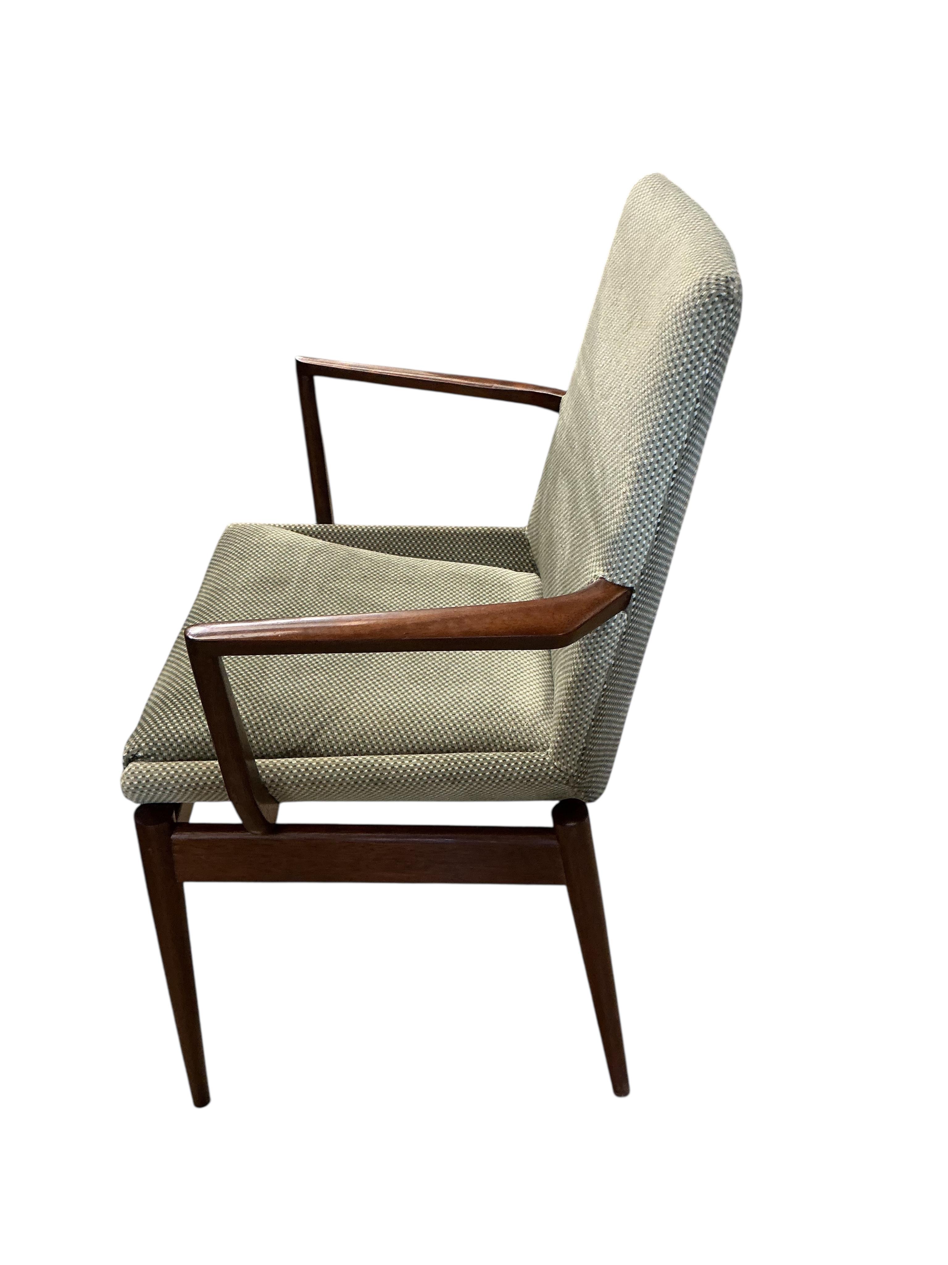 A mid century Archie Shine Indian rosewood extending dining table, width 144cm, depth 84cm, height 72cm and six upholstered chairs, two with arms
